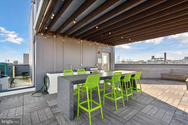 1501 N 31st St Unit 205, Philadelphia, PA 19121 - wooden deck with a patio area, a city view, and outdoor dry bar