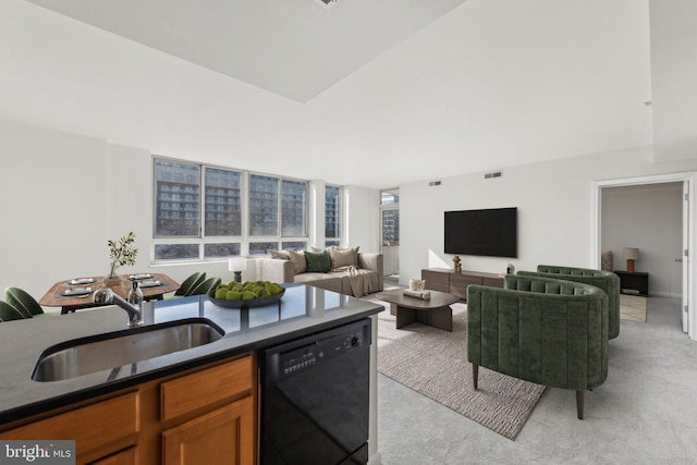 interior space featuring light carpet, dishwasher, and sink