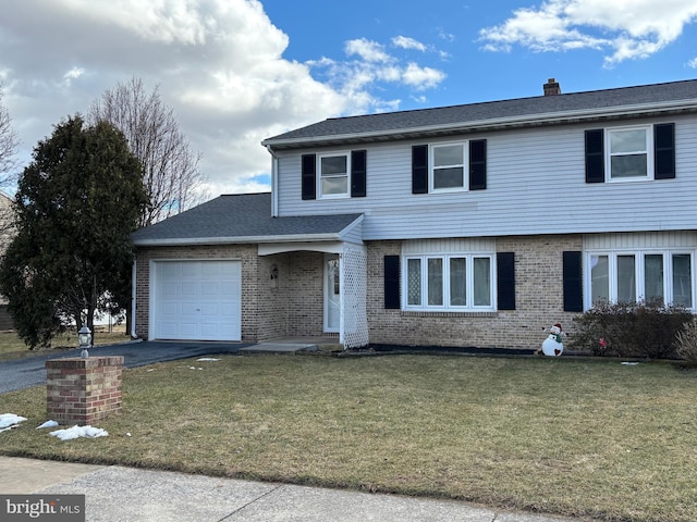 front facade with a garage and a front lawn