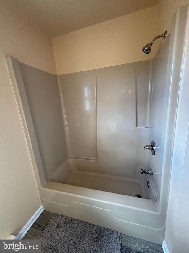 bathroom with shower / bathing tub combination