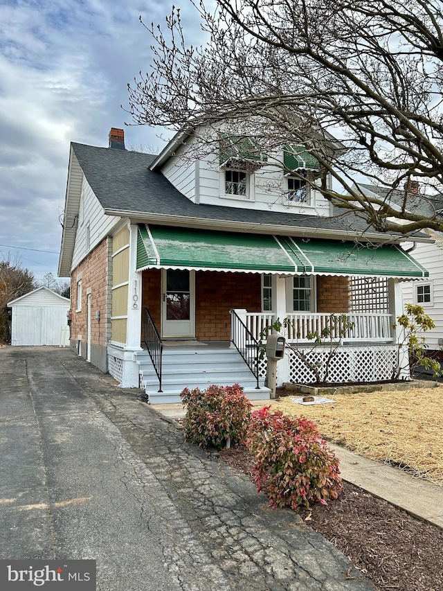 view of front of property with an outbuilding and covered porch