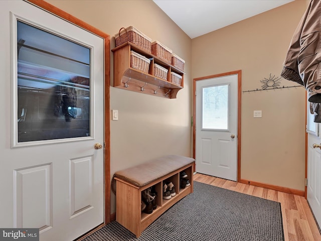 mudroom with light hardwood / wood-style floors