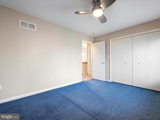 unfurnished bedroom featuring a closet, ceiling fan, and carpet