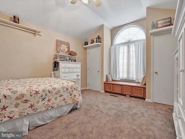 bedroom featuring lofted ceiling, light colored carpet, and ceiling fan