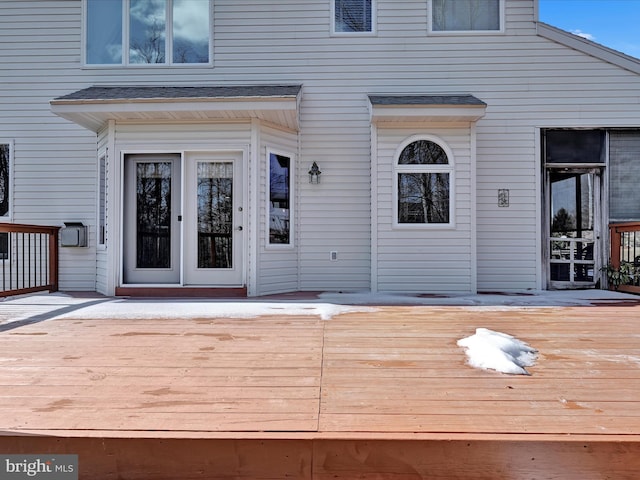 entrance to property featuring a deck