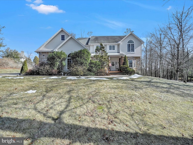 front of property featuring a front lawn