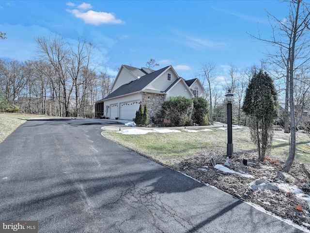 view of property exterior with a garage