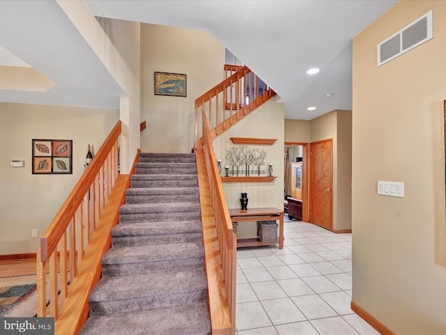 stairs with tile patterned flooring