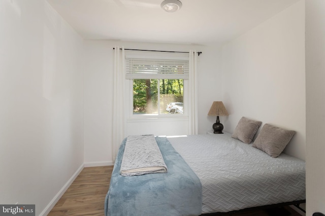 bedroom with wood-type flooring