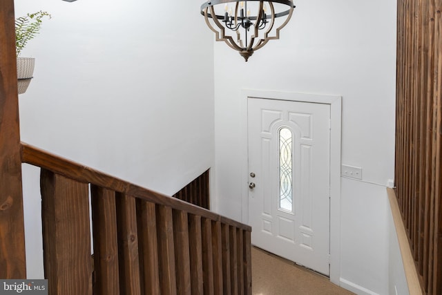 entrance foyer featuring a notable chandelier