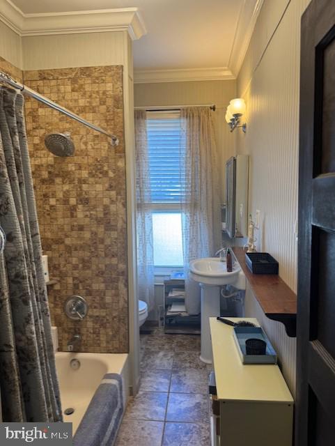 full bathroom featuring shower / bathtub combination with curtain, ornamental molding, toilet, and vanity