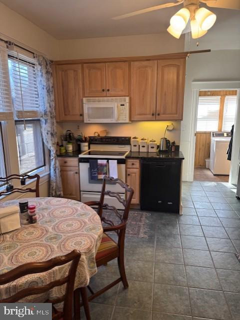 kitchen with ceiling fan, white appliances, and dark tile patterned floors