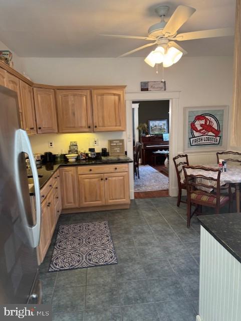 kitchen featuring stainless steel fridge and ceiling fan