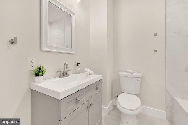 full bathroom featuring toilet, baseboards, and vanity