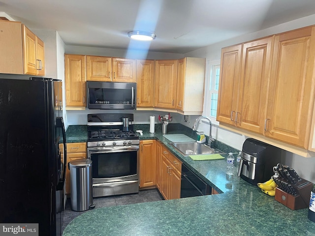 kitchen with sink and black appliances