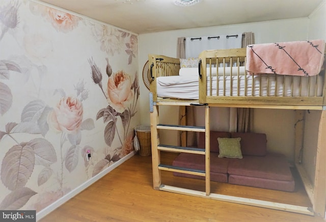 bedroom with wood-type flooring