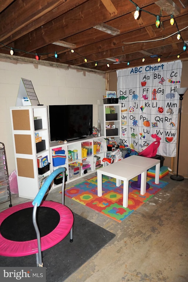 playroom featuring concrete flooring