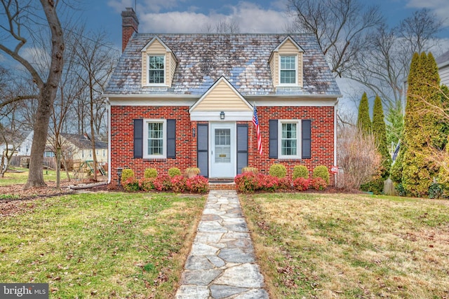 cape cod-style house with a front lawn