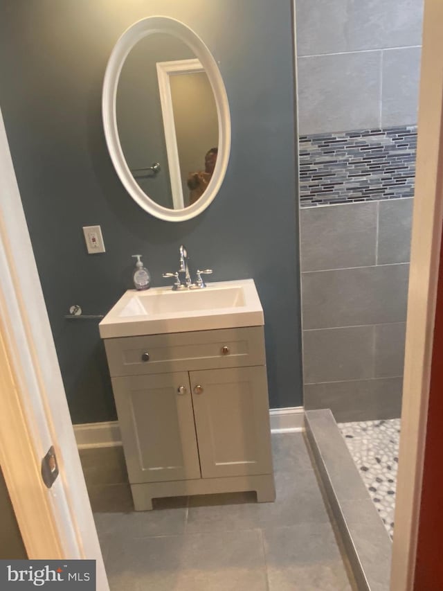 bathroom featuring tile patterned flooring and vanity