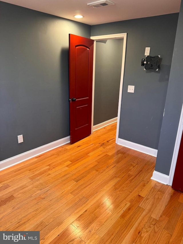 unfurnished room featuring light wood-type flooring