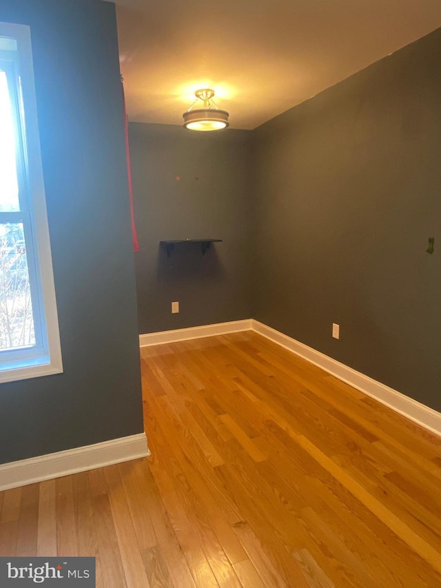 empty room featuring hardwood / wood-style flooring