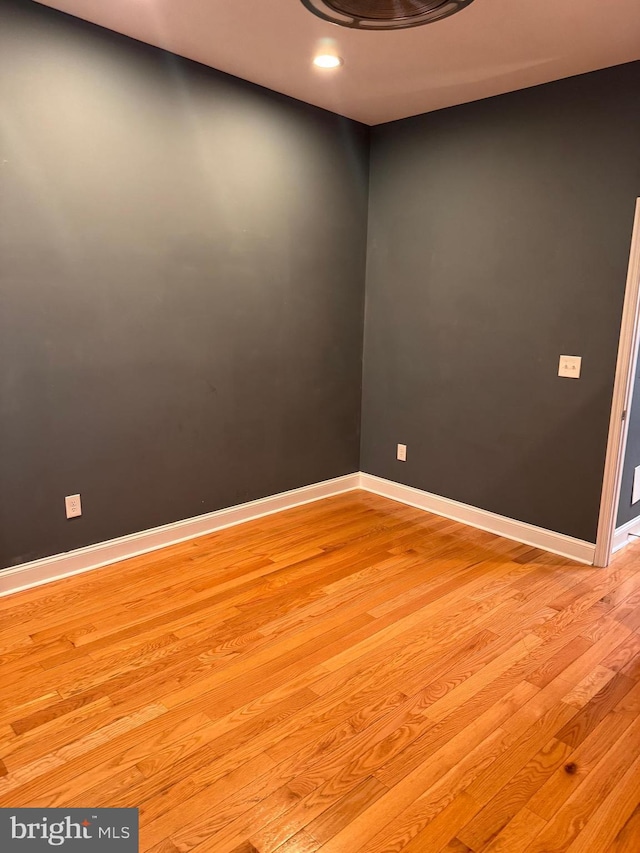 empty room with light hardwood / wood-style flooring