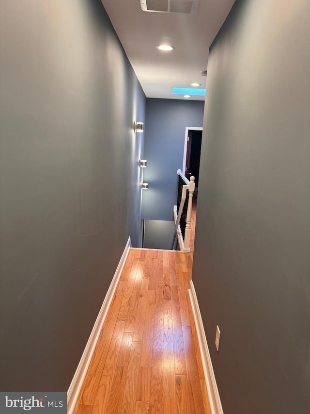 corridor featuring hardwood / wood-style floors