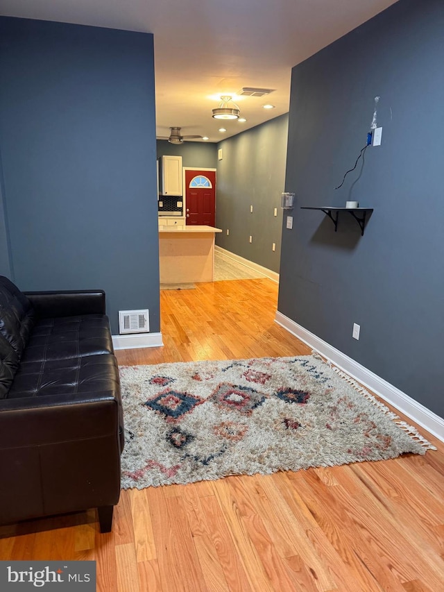 living room with light hardwood / wood-style flooring