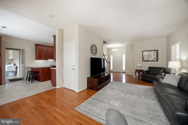 living room with light hardwood / wood-style flooring