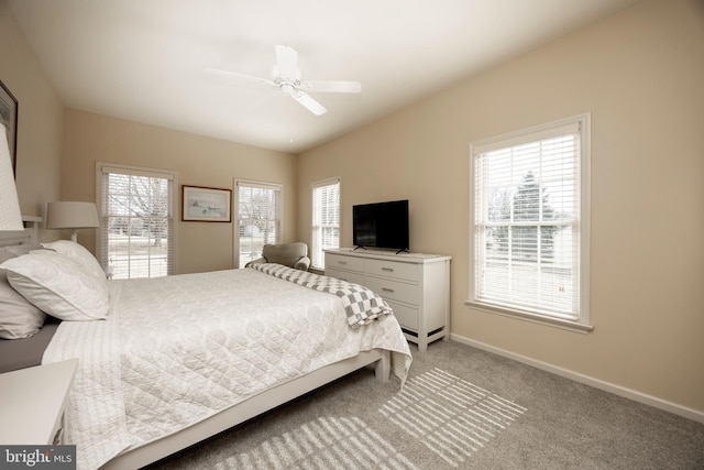 carpeted bedroom with ceiling fan