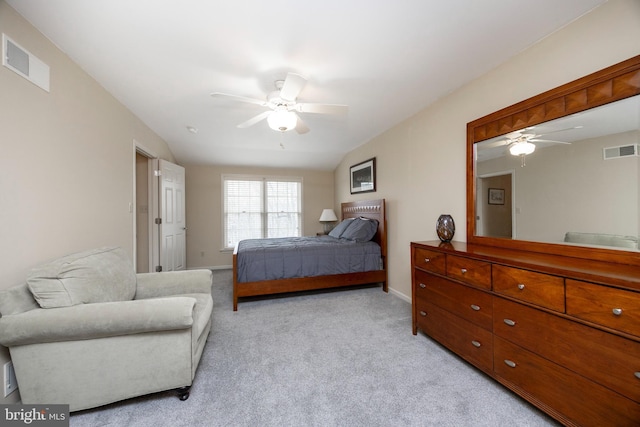 bedroom featuring light carpet, vaulted ceiling, and ceiling fan