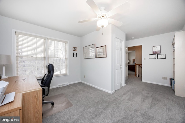 carpeted office with ceiling fan