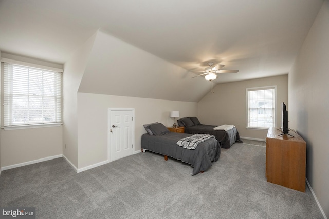 carpeted bedroom with vaulted ceiling and ceiling fan