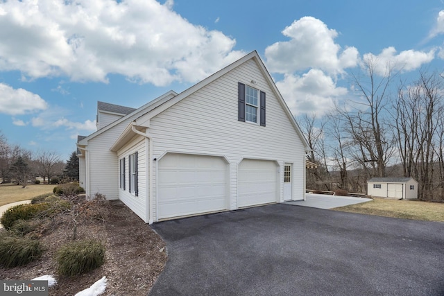 view of side of property with a garage