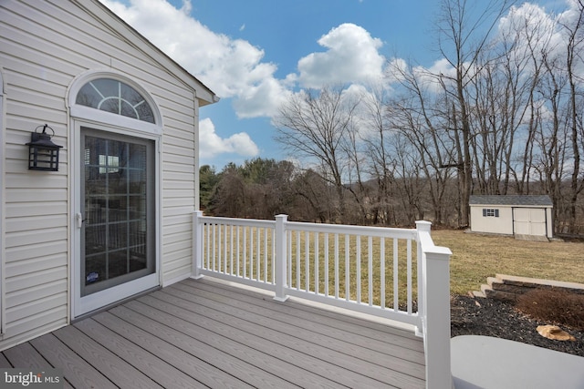 deck with a yard and a storage unit