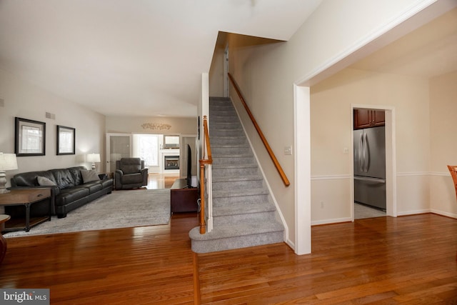 stairway with hardwood / wood-style flooring