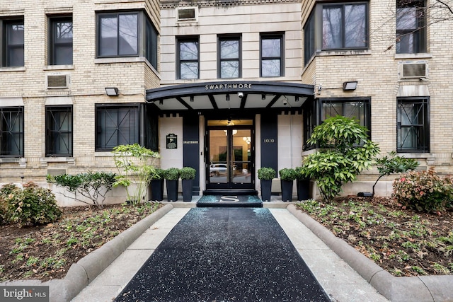 property entrance with french doors and a wall mounted AC