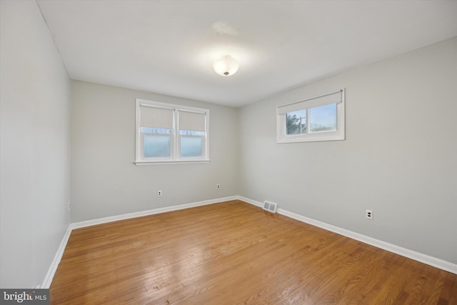 unfurnished room with light hardwood / wood-style floors