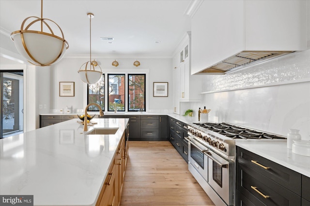 kitchen featuring dark cabinets, white cabinets, hanging light fixtures, double oven range, and custom range hood