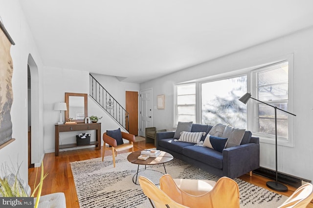 living room featuring a wealth of natural light and light hardwood / wood-style flooring