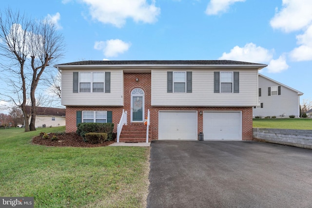 split foyer home with a garage and a front lawn