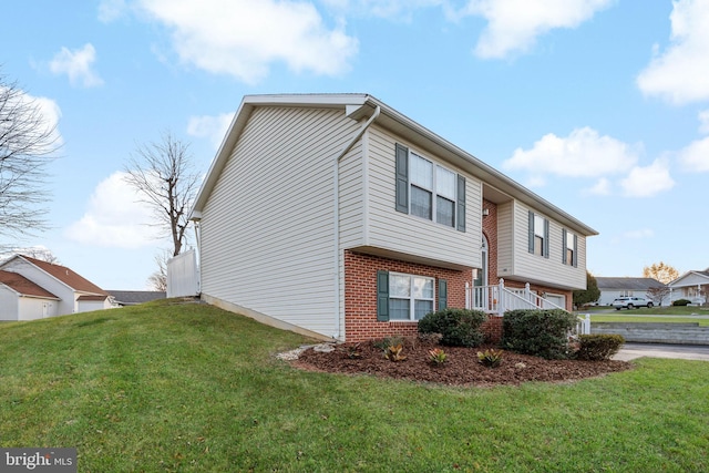 view of home's exterior with a garage and a lawn