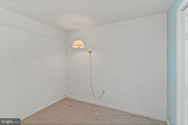 unfurnished room with light carpet