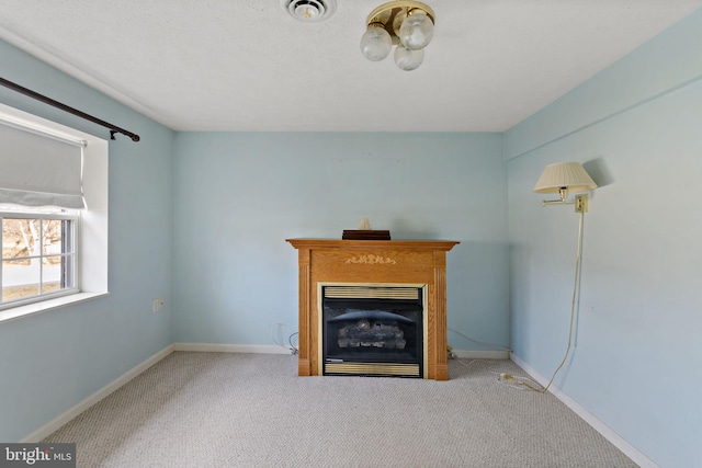 unfurnished living room featuring light carpet