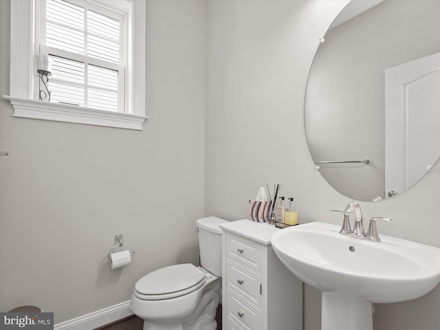 bathroom featuring toilet and sink