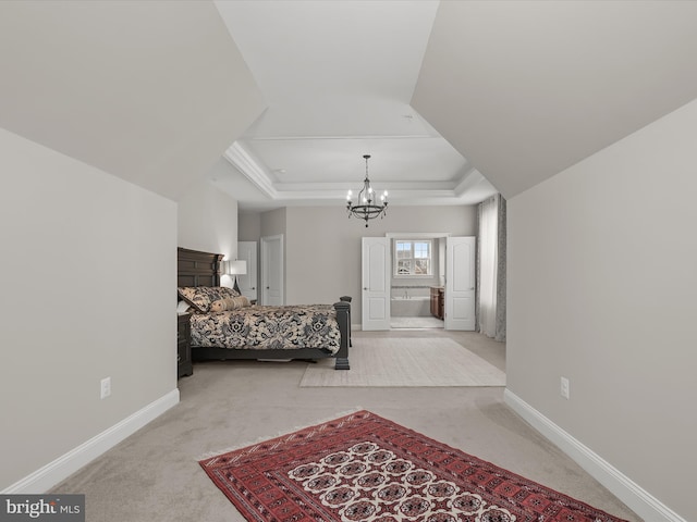 bedroom with a chandelier, light colored carpet, and a raised ceiling