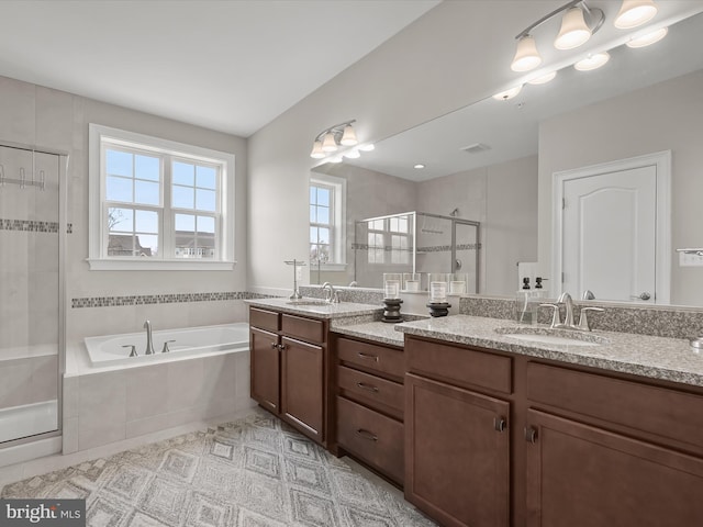 bathroom with tile patterned flooring, vanity, and separate shower and tub