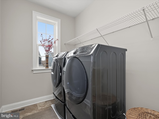 laundry room featuring independent washer and dryer