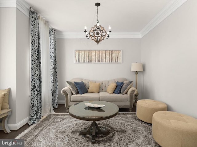 living room with hardwood / wood-style flooring, ornamental molding, and a notable chandelier