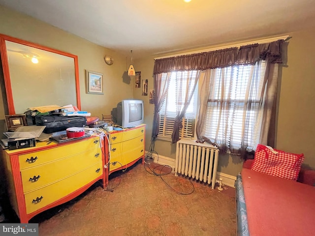 bedroom featuring radiator